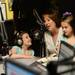 Emily Lickman, 7, smiles as her mother Michelle, holding sister Sophia, 5, during the Mott Takeover at 1050 WTKA on Friday, May 17, 2013. Melanie Maxwell I AnnArbor.com